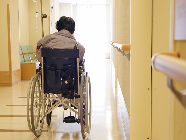 Back view of elderly woman sitting on wheelchair